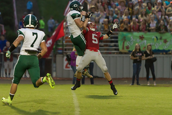 Remington Stanley catches pass above Bradley Lythgoe then goes i